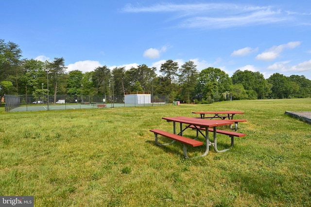 view of property's community featuring a yard