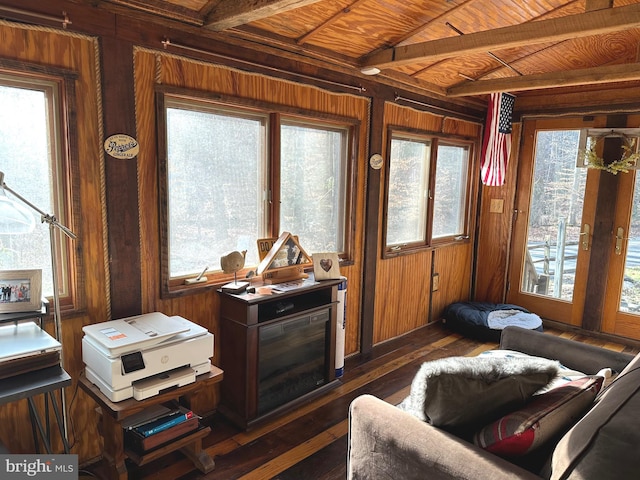 sunroom with beam ceiling, plenty of natural light, and wood ceiling