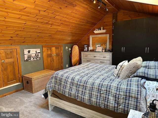 bedroom with wood walls, light colored carpet, lofted ceiling, and wood ceiling