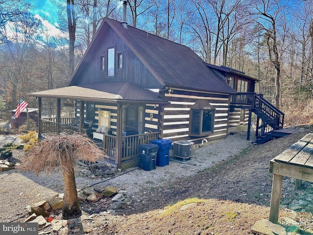 view of property exterior featuring a porch and central air condition unit