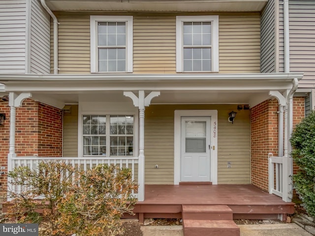 doorway to property with a porch