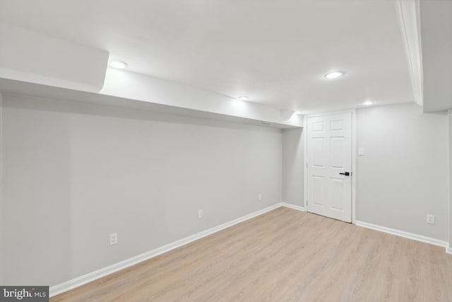 basement featuring light hardwood / wood-style flooring