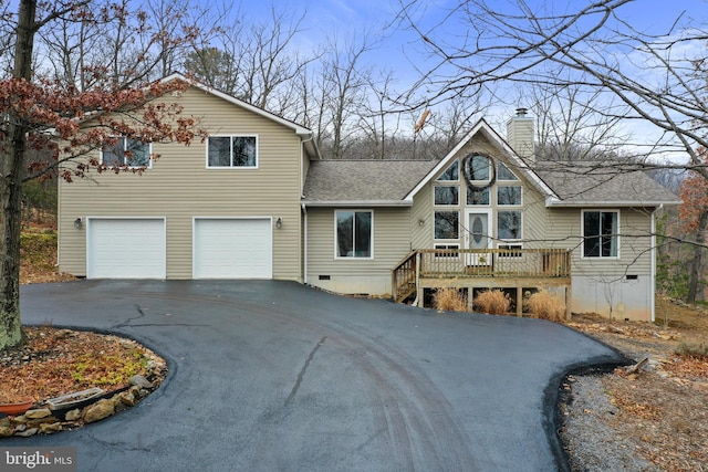 view of front of home with a shingled roof, a chimney, aphalt driveway, crawl space, and a wooden deck