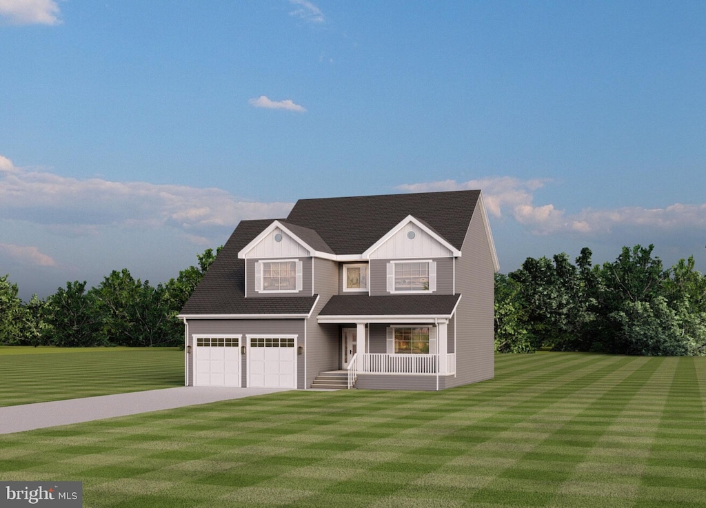 view of front of home featuring a front yard, a garage, and covered porch