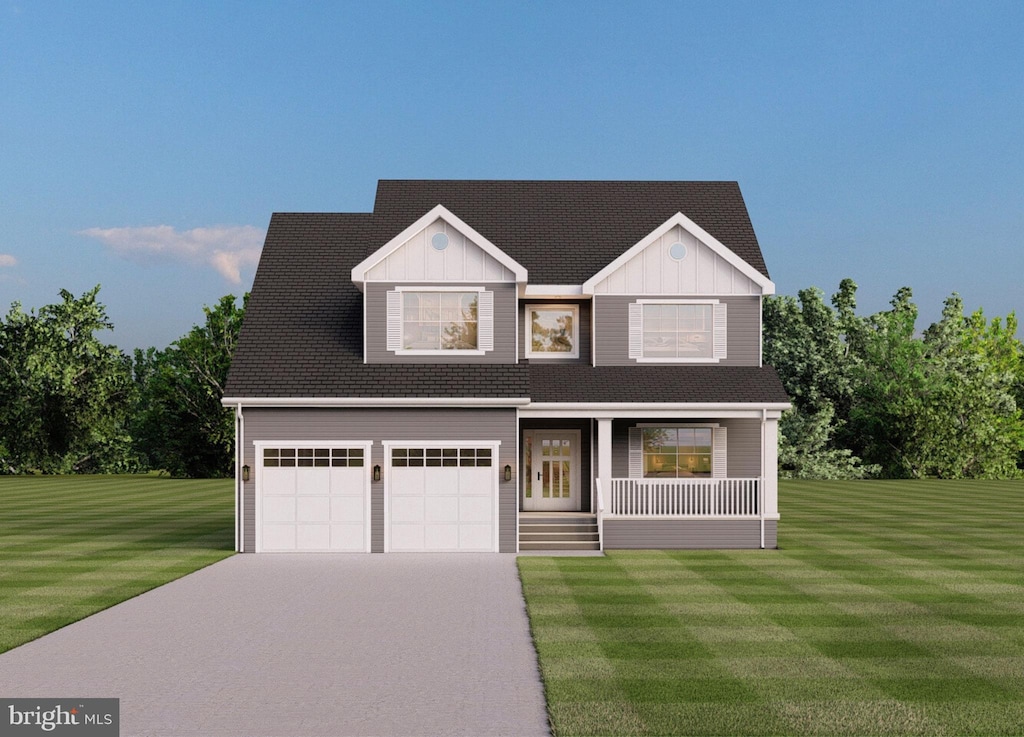 view of front facade with a front yard and a garage