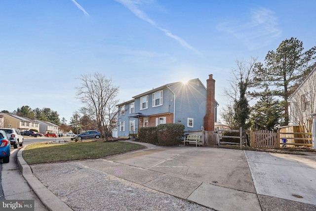 view of side of property featuring a lawn