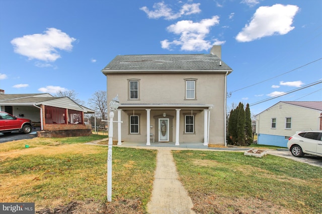 view of front of home featuring a front yard and a porch