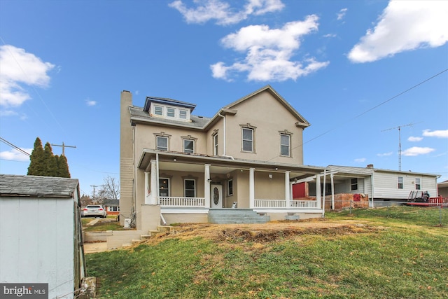 view of front of property featuring a porch and a front yard