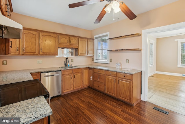 kitchen with ceiling fan, dishwasher, sink, light stone counters, and dark hardwood / wood-style floors