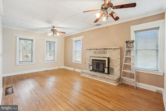 unfurnished living room featuring ceiling fan, light hardwood / wood-style floors, and crown molding