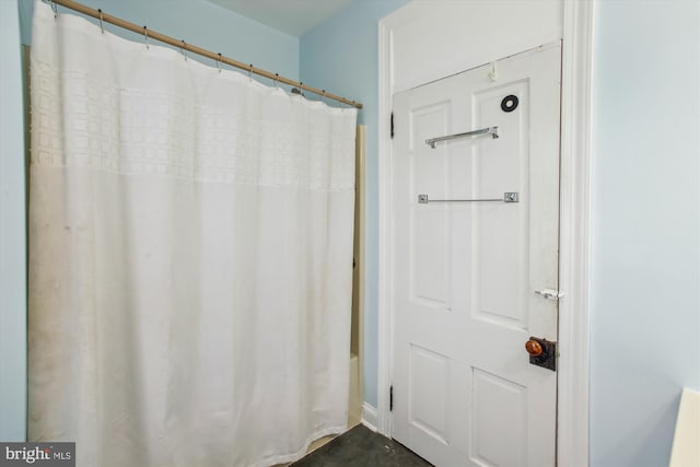 bathroom featuring shower / bath combination with curtain