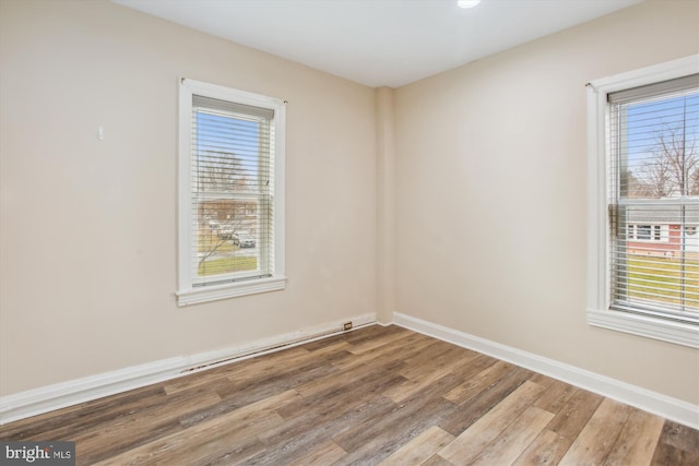 spare room featuring hardwood / wood-style flooring