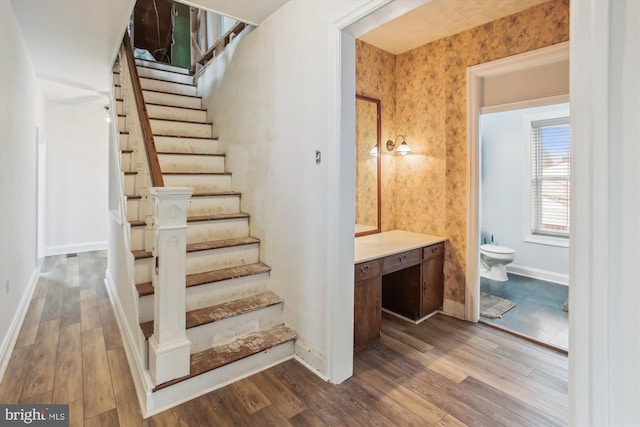 stairs featuring wood-type flooring