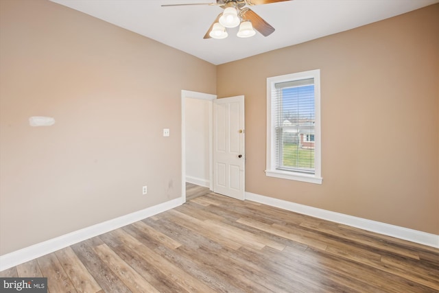 spare room featuring ceiling fan and light wood-type flooring