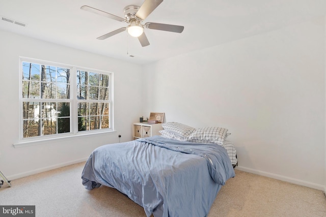 bedroom with light carpet and ceiling fan