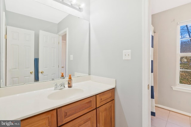 bathroom with tile patterned flooring and vanity