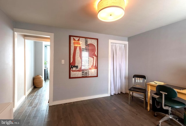 office featuring visible vents, baseboards, and dark wood-style flooring