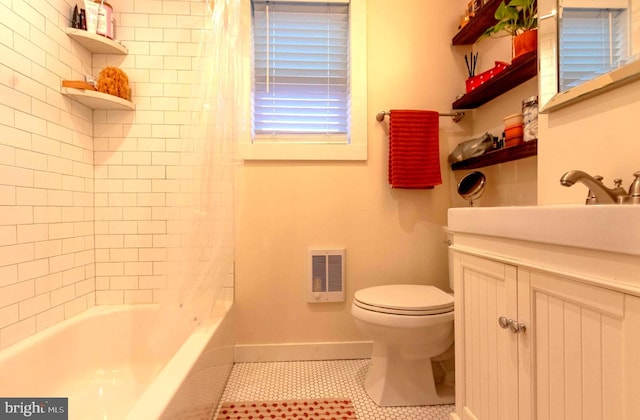 full bathroom featuring tile patterned floors, vanity, toilet, and shower / bathtub combination with curtain