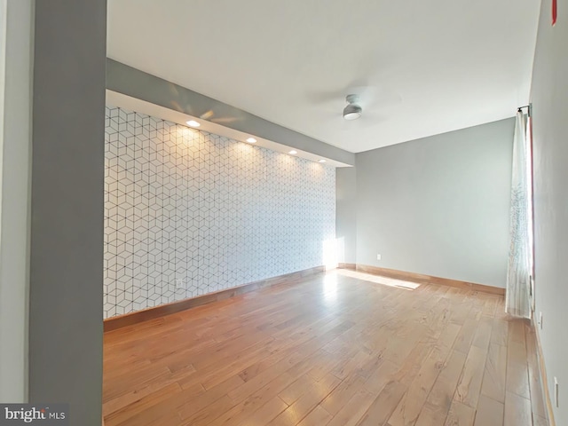 spare room with light hardwood / wood-style flooring