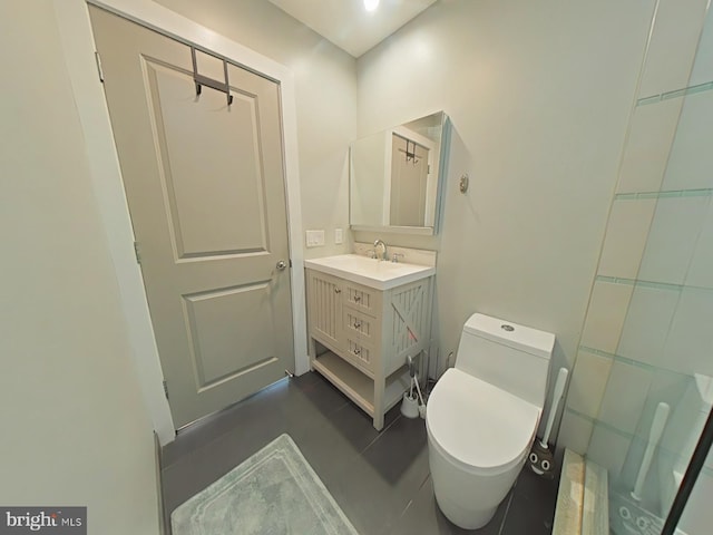 bathroom featuring tile patterned floors, vanity, and toilet