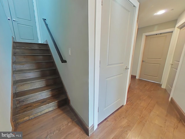 stairway featuring hardwood / wood-style flooring