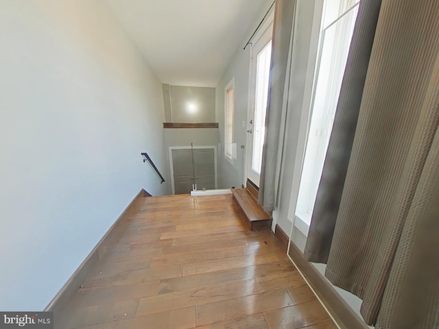 corridor with light wood-type flooring