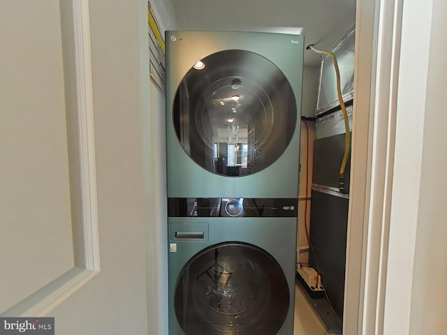 laundry room featuring stacked washing maching and dryer