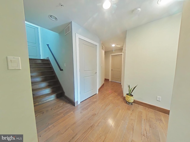 hallway with light hardwood / wood-style flooring