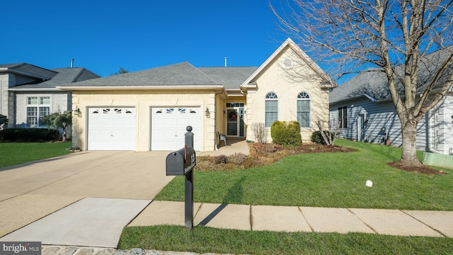 single story home featuring a garage and a front lawn