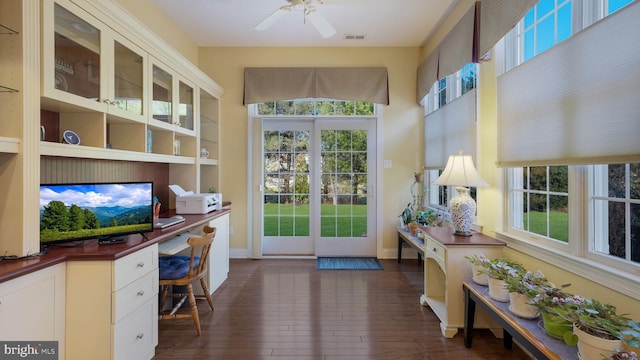 home office featuring ceiling fan and dark hardwood / wood-style floors