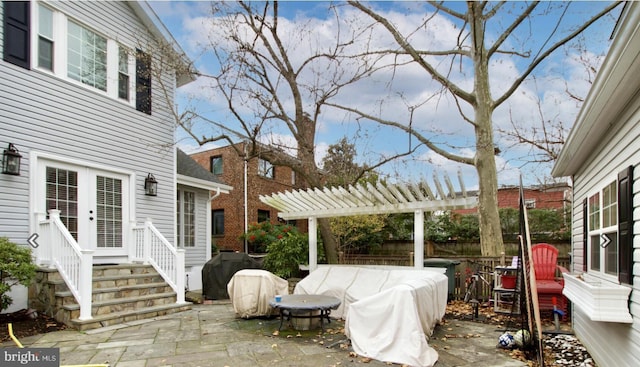 view of patio featuring area for grilling and a pergola