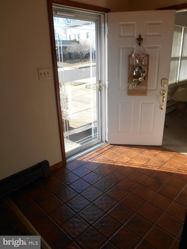 entryway featuring baseboard heating and tile patterned flooring