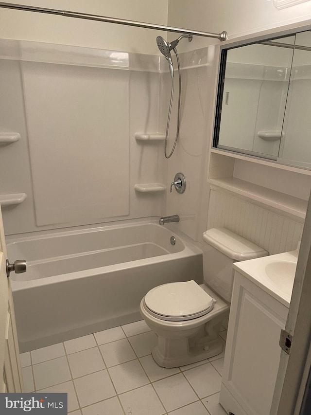 full bath with tile patterned flooring, shower / bathing tub combination, vanity, and toilet