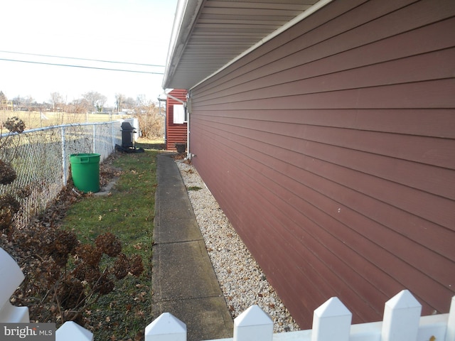 view of property exterior with fence