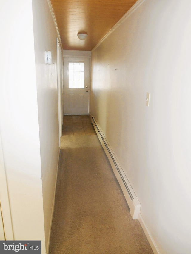 hallway with carpet, baseboard heating, ornamental molding, wood ceiling, and baseboards