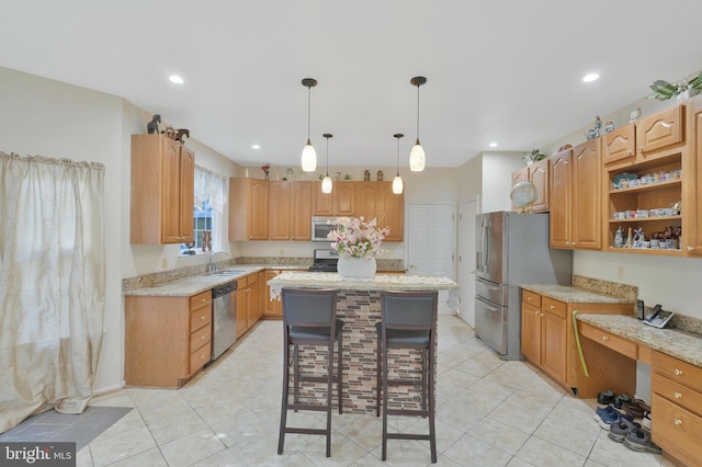 kitchen with light stone countertops, stainless steel appliances, sink, pendant lighting, and a center island