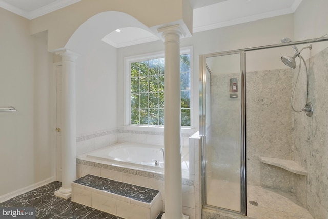 bathroom with decorative columns, shower with separate bathtub, and ornamental molding