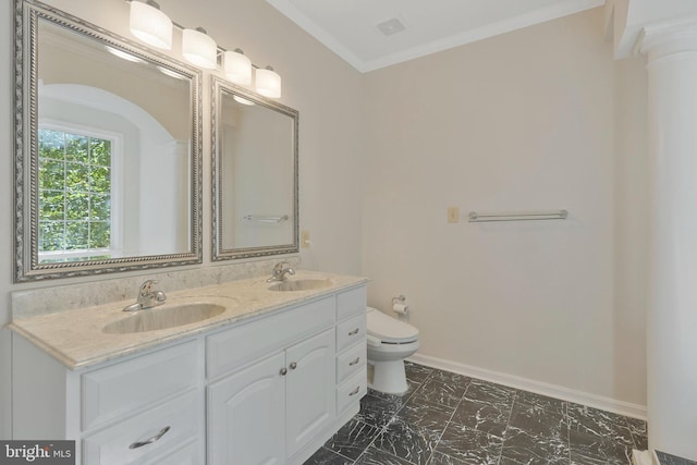 bathroom with vanity, toilet, and crown molding