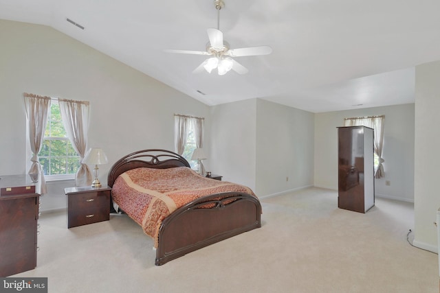 carpeted bedroom with ceiling fan and lofted ceiling