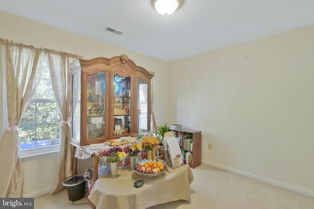 view of carpeted dining area