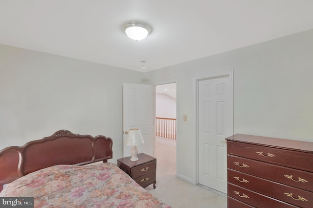 bedroom with light colored carpet