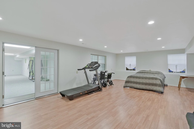 interior space with access to exterior, french doors, and light hardwood / wood-style flooring