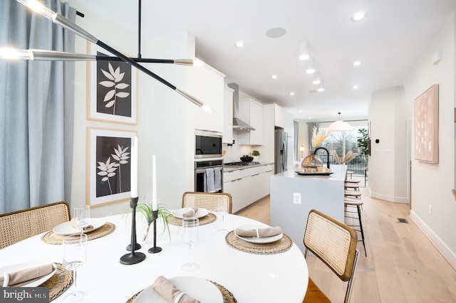 dining area featuring light hardwood / wood-style floors