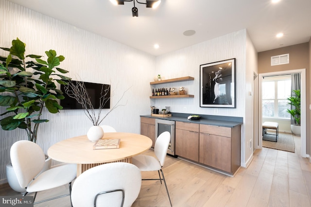 interior space featuring light wood-type flooring and beverage cooler