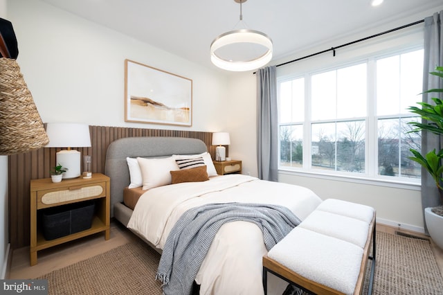 bedroom with hardwood / wood-style floors