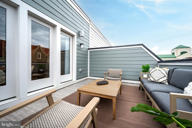 wooden deck with an outdoor hangout area