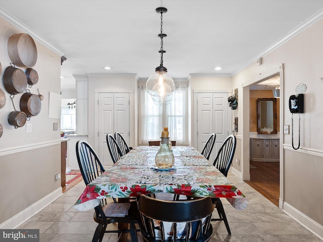 dining area featuring ornamental molding and a healthy amount of sunlight