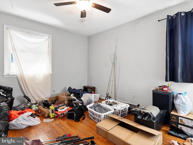 bedroom featuring hardwood / wood-style flooring and ceiling fan