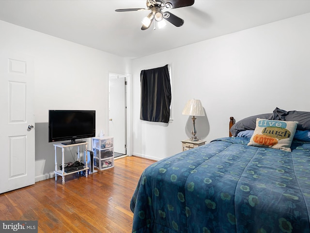 bedroom featuring hardwood / wood-style flooring and ceiling fan