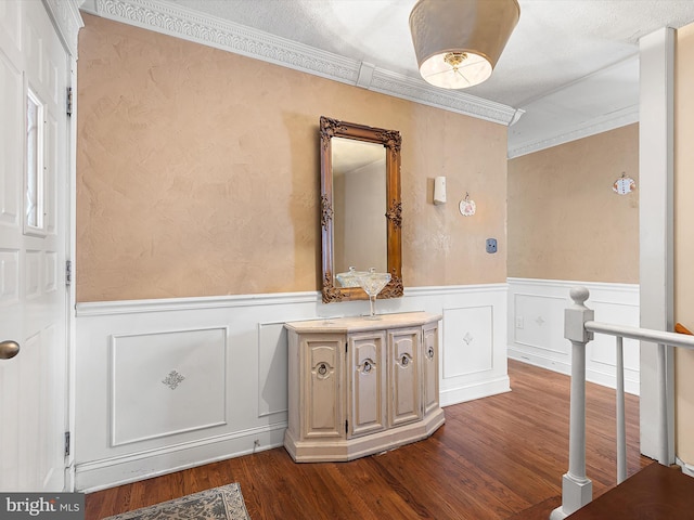 bathroom featuring crown molding and hardwood / wood-style floors